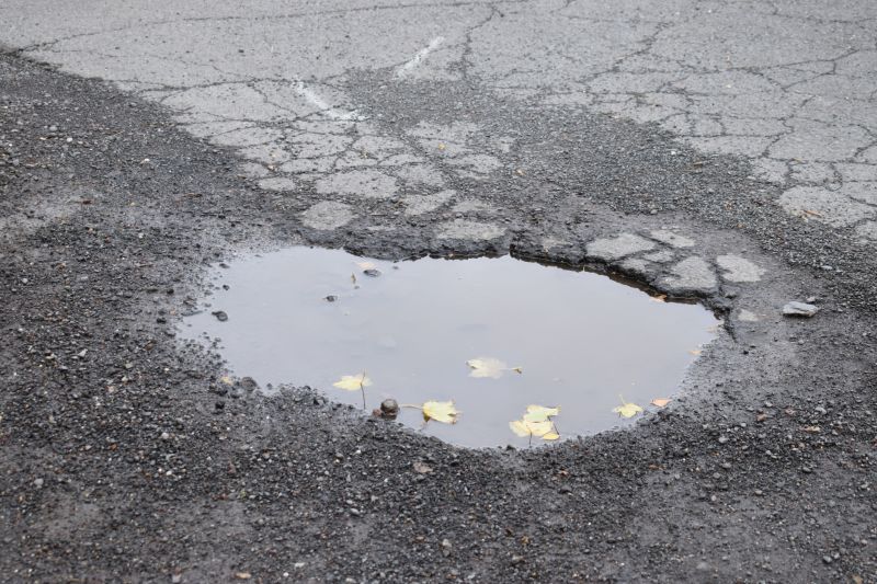 How Weather Conditions Affect Asphalt Cracks And Potholes